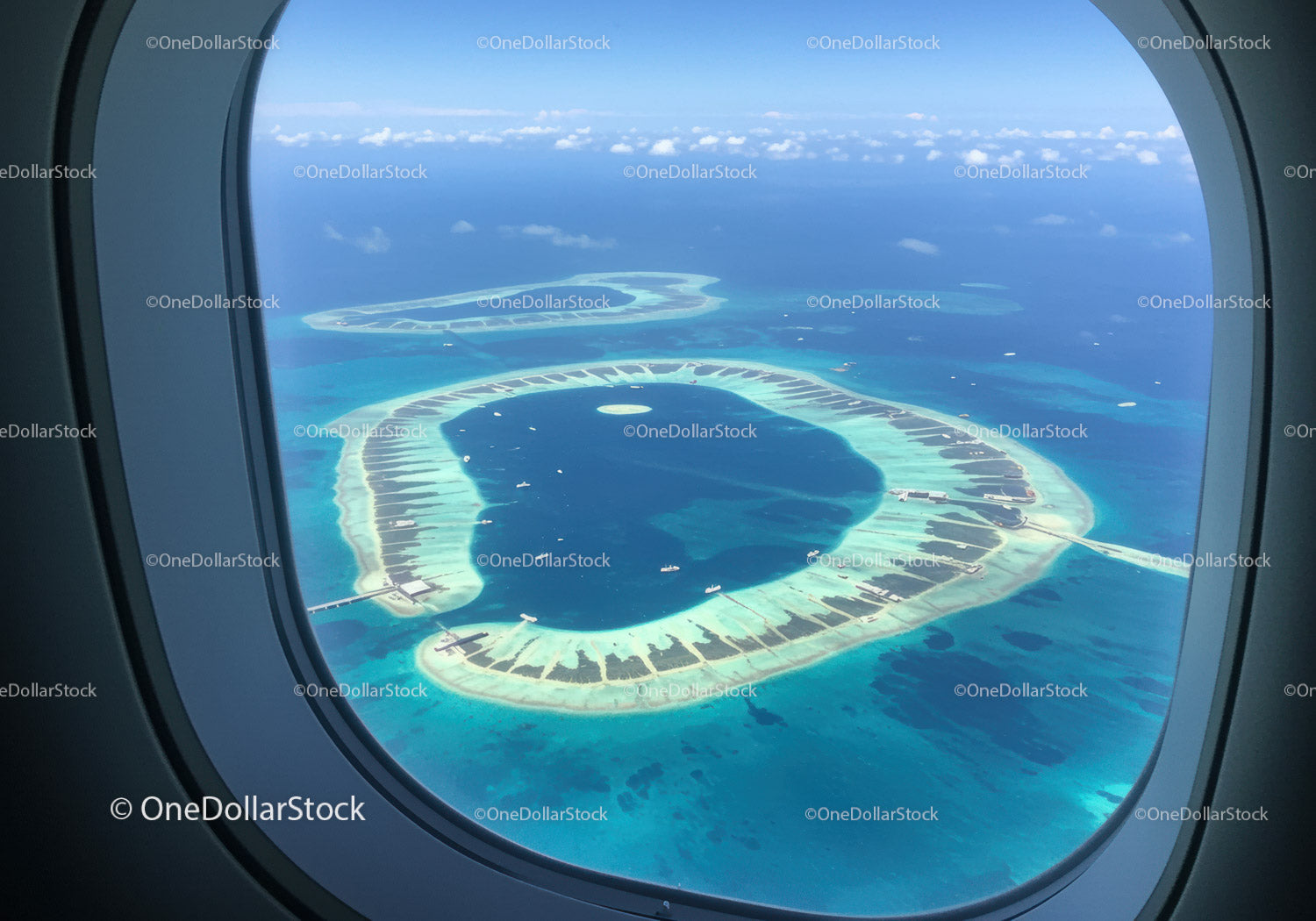 Aerial View of Tropical Atolls with Turquoise Waters and White Sand Beaches