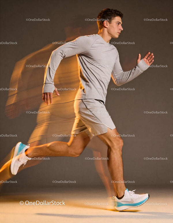 Young man sprinting in sportswear with dynamic motion