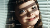 Closeup of a smiling girl with sunlight and shadows