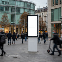 Urban street scene with blank digital billboard and pedestrians