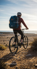 Young Man Cycling on Cliffside Trail with Scenic Ocean View