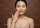 Young Woman Applying Facial Moisturizer in Beauty Skincare Routine