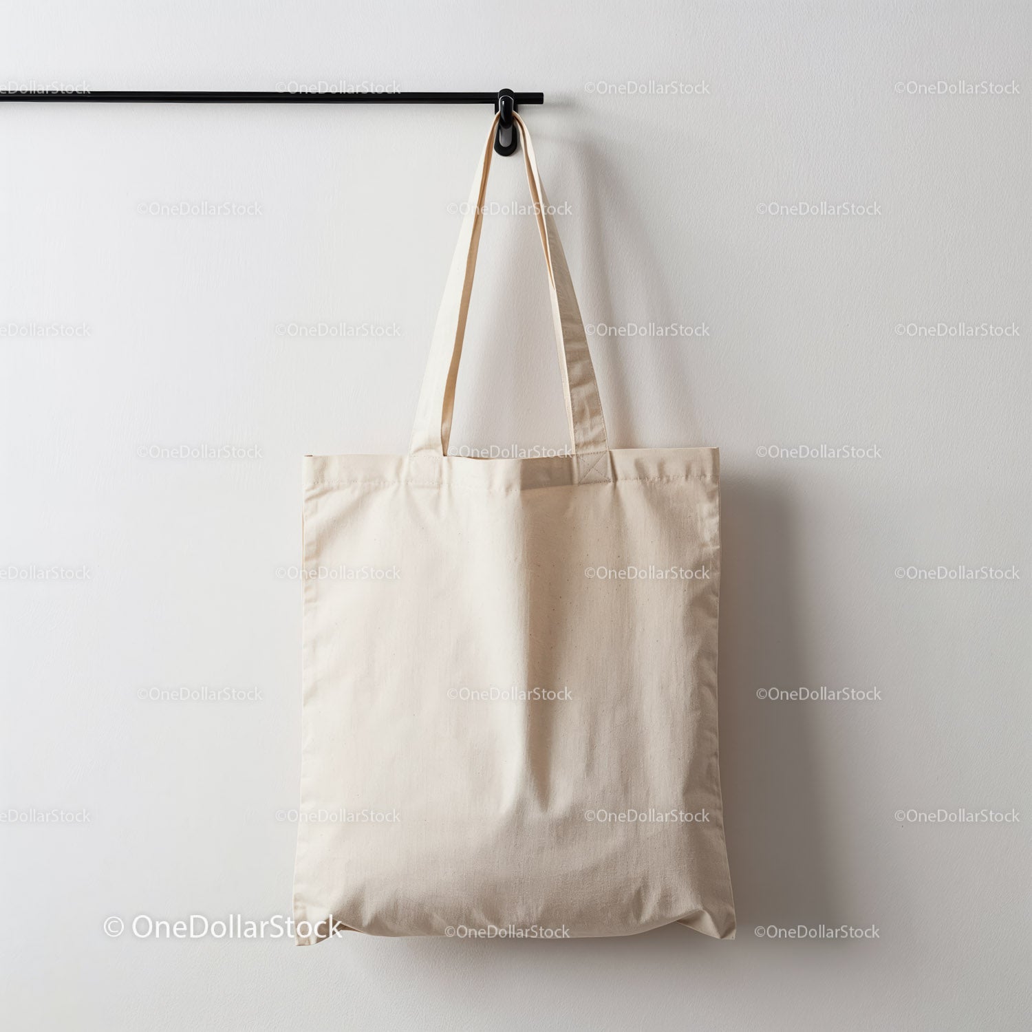 Empty Natural Cotton Tote Bag Hanging on Wall Hook
