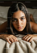 Close-up Portrait of a Young Woman with Brown Eyes and Hair Clips