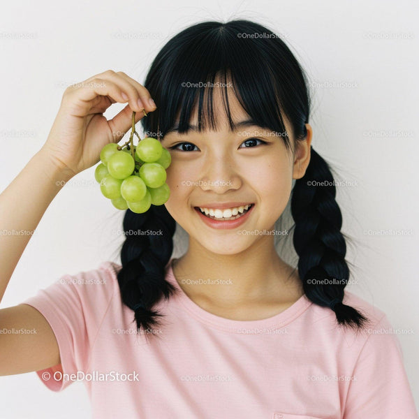 Happy Girl Holding Green Grapes Portrait with Bright Smile