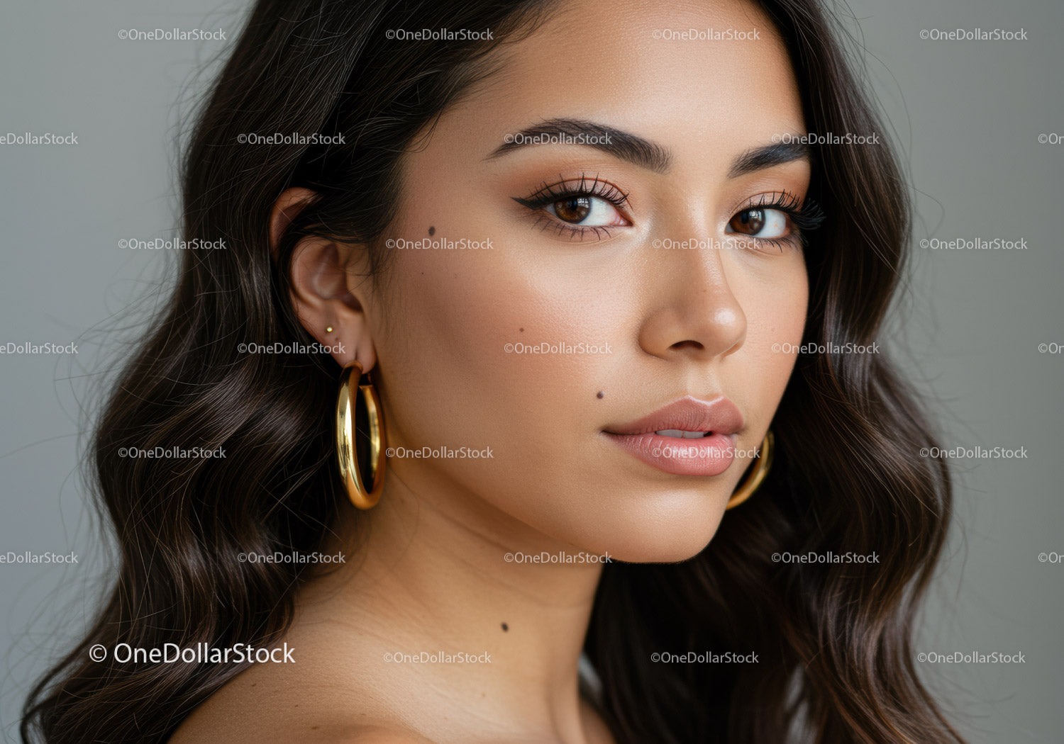 Portrait of a Beautiful Woman with Brown Eyes and Gold Earrings