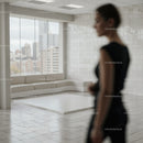 Blurred woman in modern minimalist living room interior