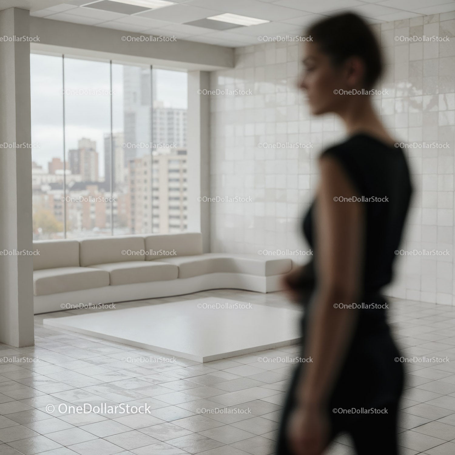 Blurred woman in modern minimalist living room interior