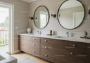 Modern Bathroom with Double Vanity and Round Mirrors in Bright Natural Light