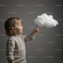 Curious toddler reaching out to fluffy cloud model