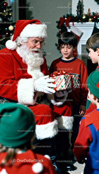 Santa Claus Giving Christmas Gift to Excited Children
