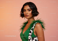 Elegant Woman Wearing Green Dress with Feathered Details and Jewelry