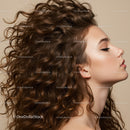 Profile of woman with voluminous curly hair and makeup