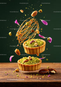 Pistachio tartlets with nuts and caramel decoration