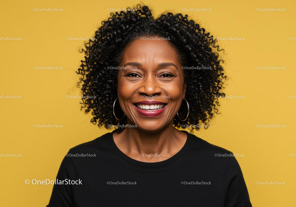 Professional Portrait of Smiling African American Woman with Curly Hair Against Yellow Background