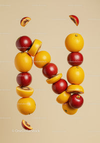 Creative fruit arrangement with oranges and red apples