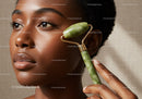 Elegant African Woman with Jade Facial Roller for Skincare and Wellness