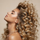 Profile of woman with flowing curly blonde hair