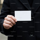 Person Holding Blank White Business Card Outdoors