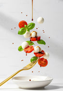 Fresh Caprese Salad Ingredients Suspended on Fork
