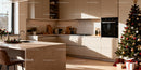 Modern kitchen with festive Christmas tree and decorations