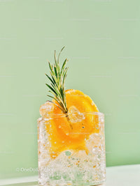 Refreshing Peach Cocktail with Rosemary Garnish