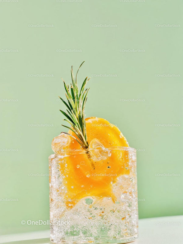 Refreshing Peach Cocktail with Rosemary Garnish