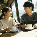 Couple sharing warm moments over coffee in cozy cafe