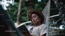 Women Relaxing in Hammock Reading Book in Green Nature Scene