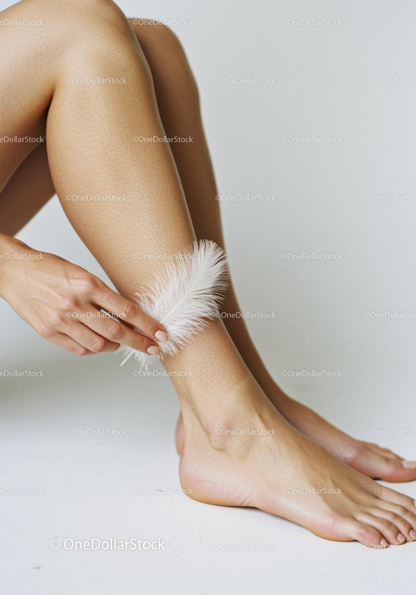 Elegant Woman Applying Feather to Smooth Skin for Beauty and Skincare