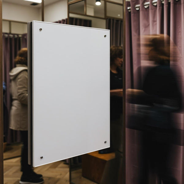 Blank white board in stylish modern fitting room interior JPG Mockup Image
