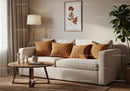 Cozy living room with neutral sofa and warm decor