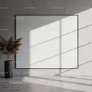 Minimalist interior with large blank canvas and vase