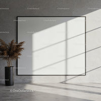 Minimalist interior with large blank canvas and vase