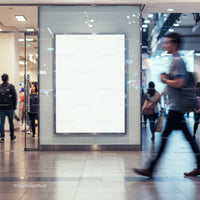 Blank vertical billboard in busy modern shopping mall