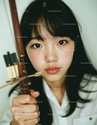 Young Woman with Black Hair and Expressive Eyes in Indoor Setting