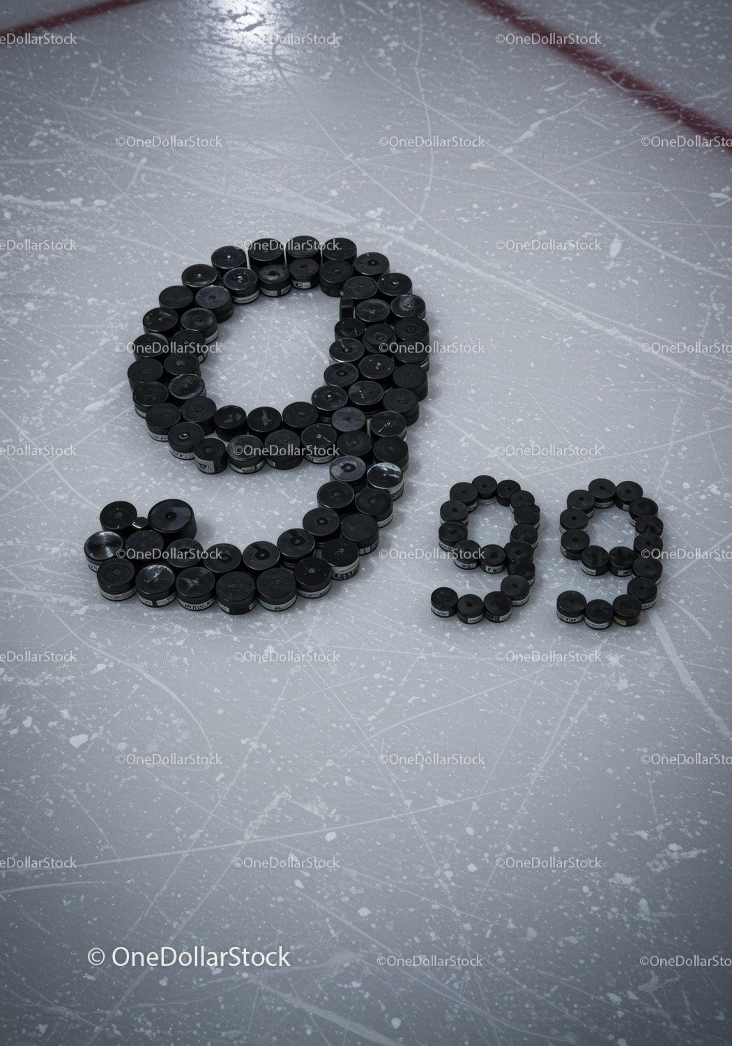 Ice hockey pucks arranged in number 99 on rink surface