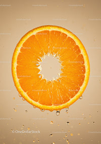 Fresh orange slice suspended in water with bubbles