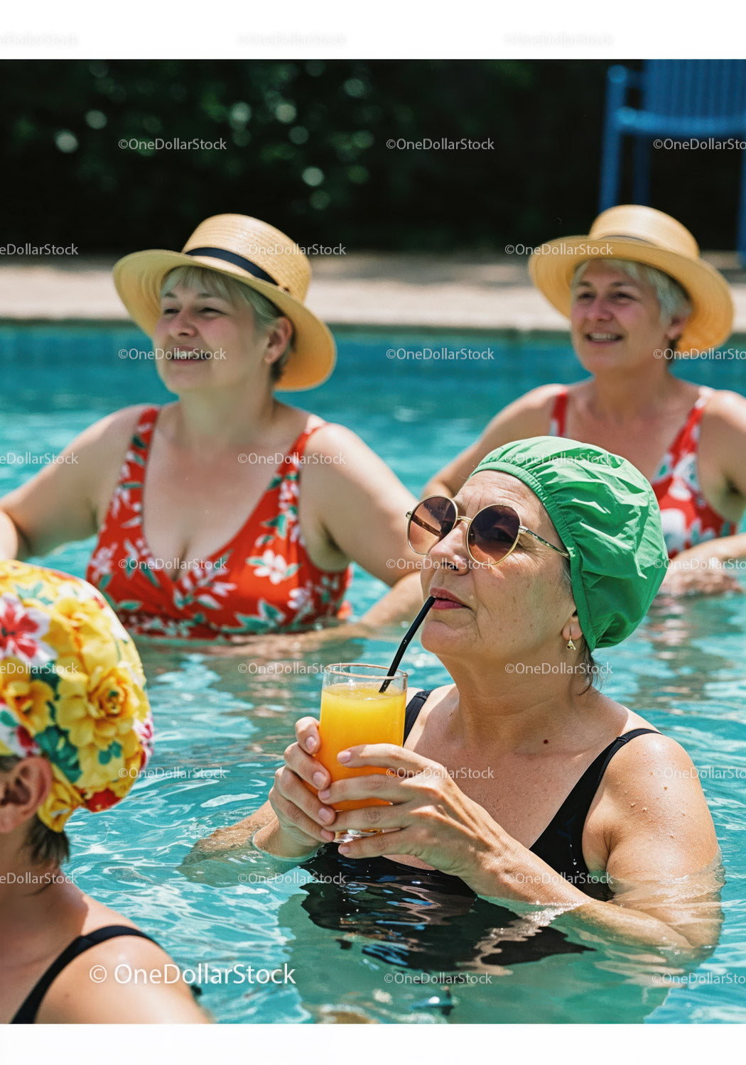Elderly Women Relaxing and Drinking Refreshing Drinks in Pool