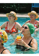 Elderly Women Relaxing and Drinking Refreshing Drinks in Pool