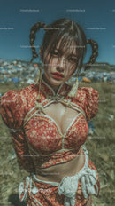 Stylish Woman in Red Patterned Outfit Standing Outdoors in Sunlight