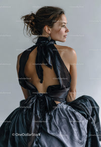 Elegant Woman in Black and Grey Gown Posing in Studio
