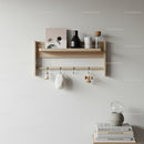 Stylish Wooden Wall Shelf with Vases and Hanging Decor in Minimalist Interior