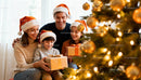 Happy family exchanging gifts by decorated Christmas tree