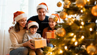 Happy family exchanging gifts by decorated Christmas tree