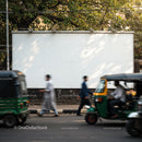 People and Rickshaws Passing by Blank City Billboard