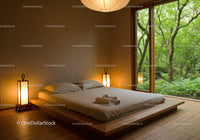 Minimalist Bedroom with Serene Forest View Through Glass Doors