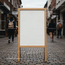 Blank wooden sandwich board on urban street pavement