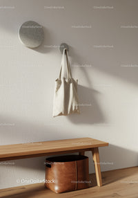 Stylish Beige Fabric Tote Bag Hanging on Modern Wall Hook in Minimalist Room