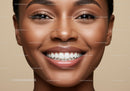 Close up of cheerful smiling young woman with glowing skin